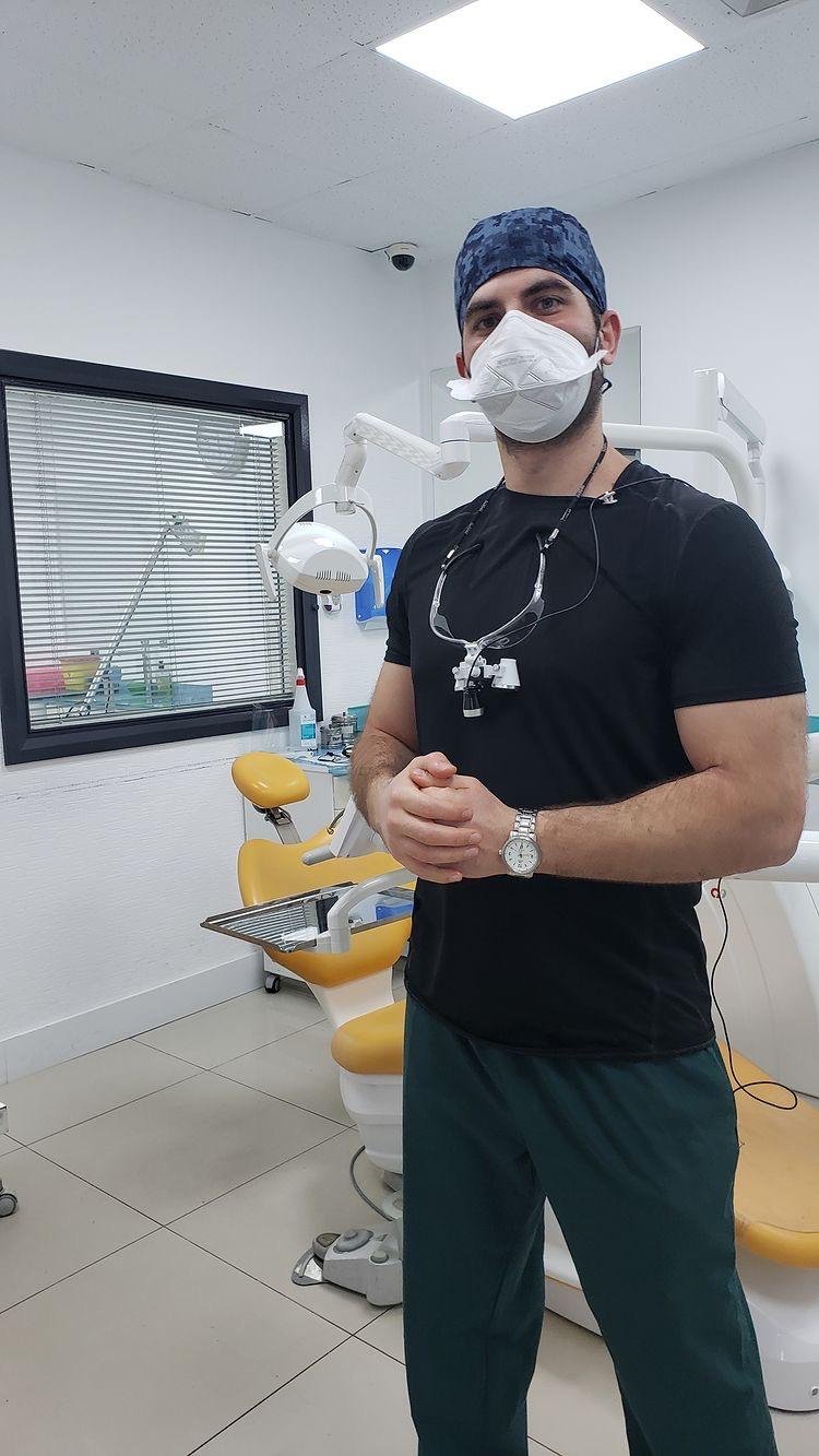 Dr Wahid Kathuda reviewing dental information